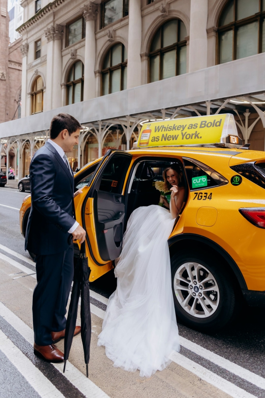 Wedding photo in a yellow cab in NYC